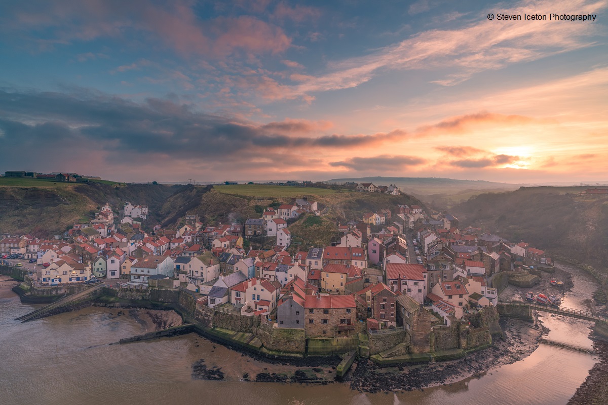 A misty sunset over Staithes